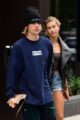 Justin Bieber and Hailey Bieber walk together in casual street style outfits during a public outing prior to the 2026 Grammy Awards.