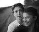 Black and white photo of Tom Holland and Zendaya's faces where they are seen hugging and very much in love